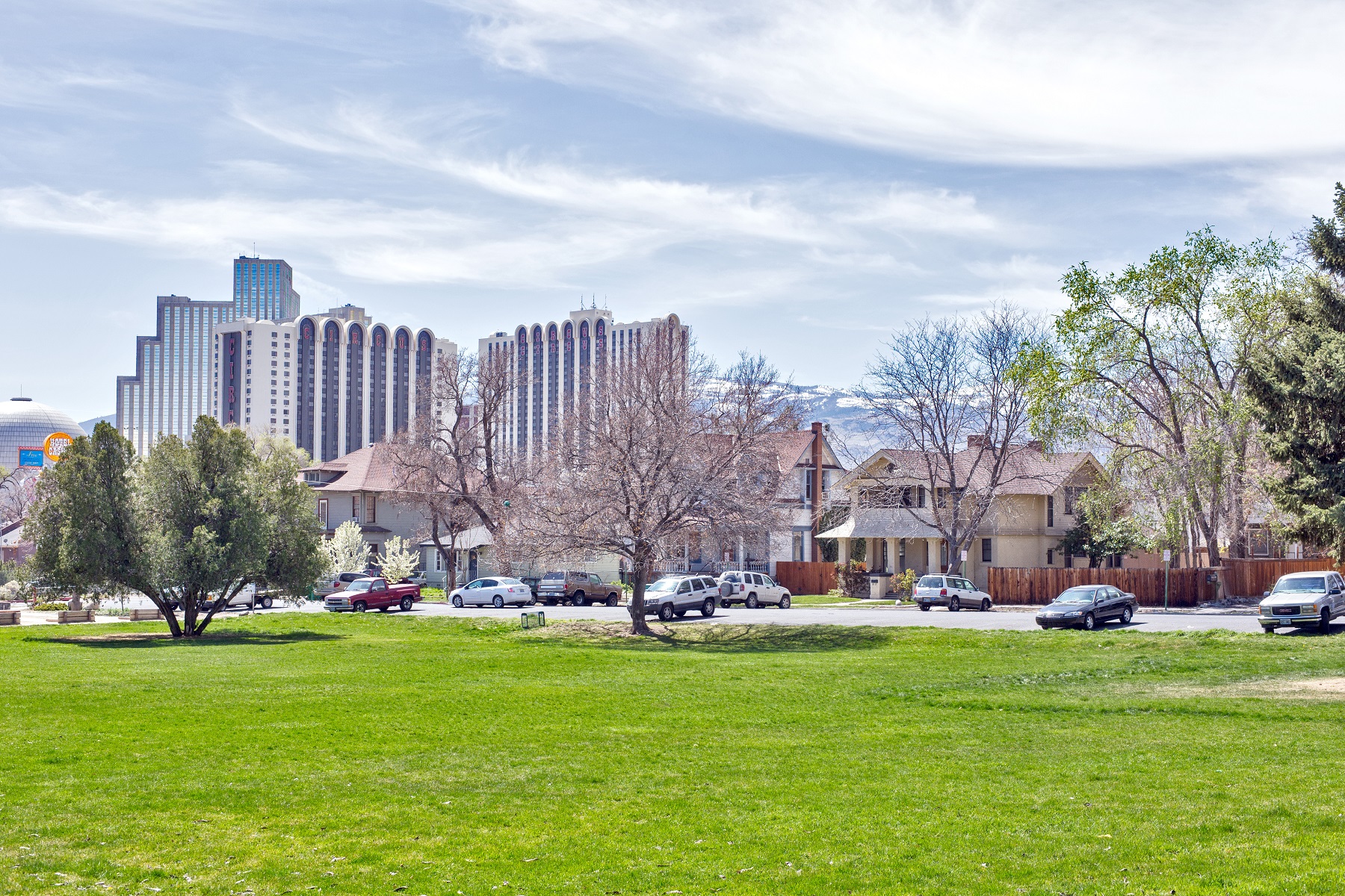 This vibrant photo show Evans Park in the summer with Downtown Reno in the background.